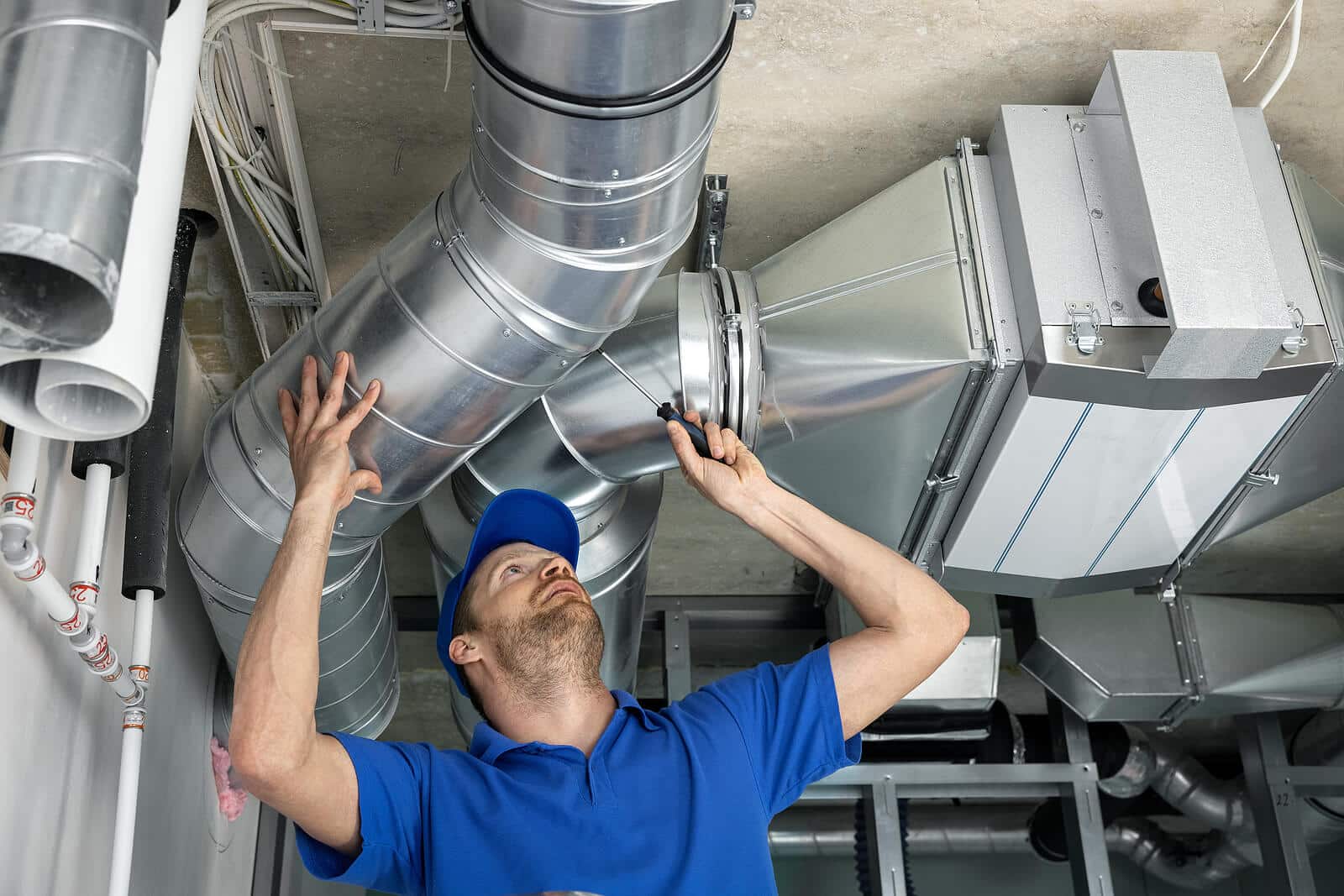 HVAC technician inspecting and repairing air ducts in Gardena