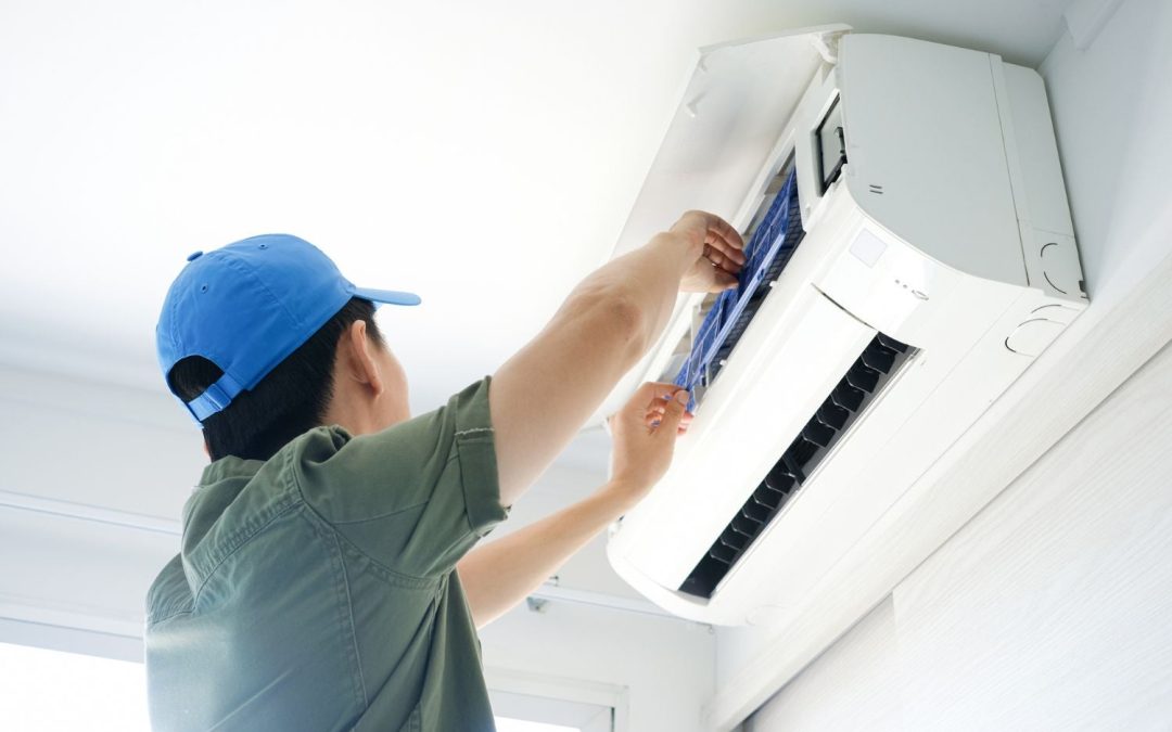 HVAC technician servicing a ductless mini split in Gardena