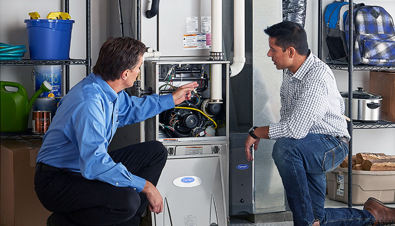 Technician evaluating a furnace for repair or replacement in Gardena