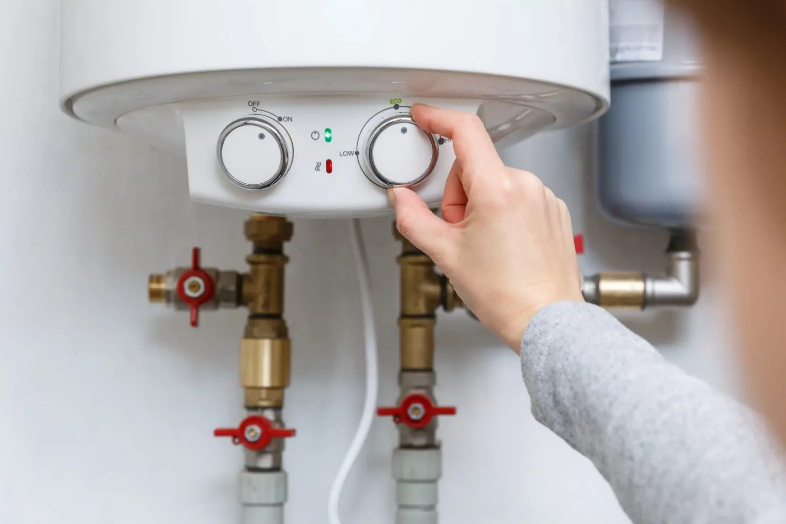 Technician adjusting a water heater in Gardena